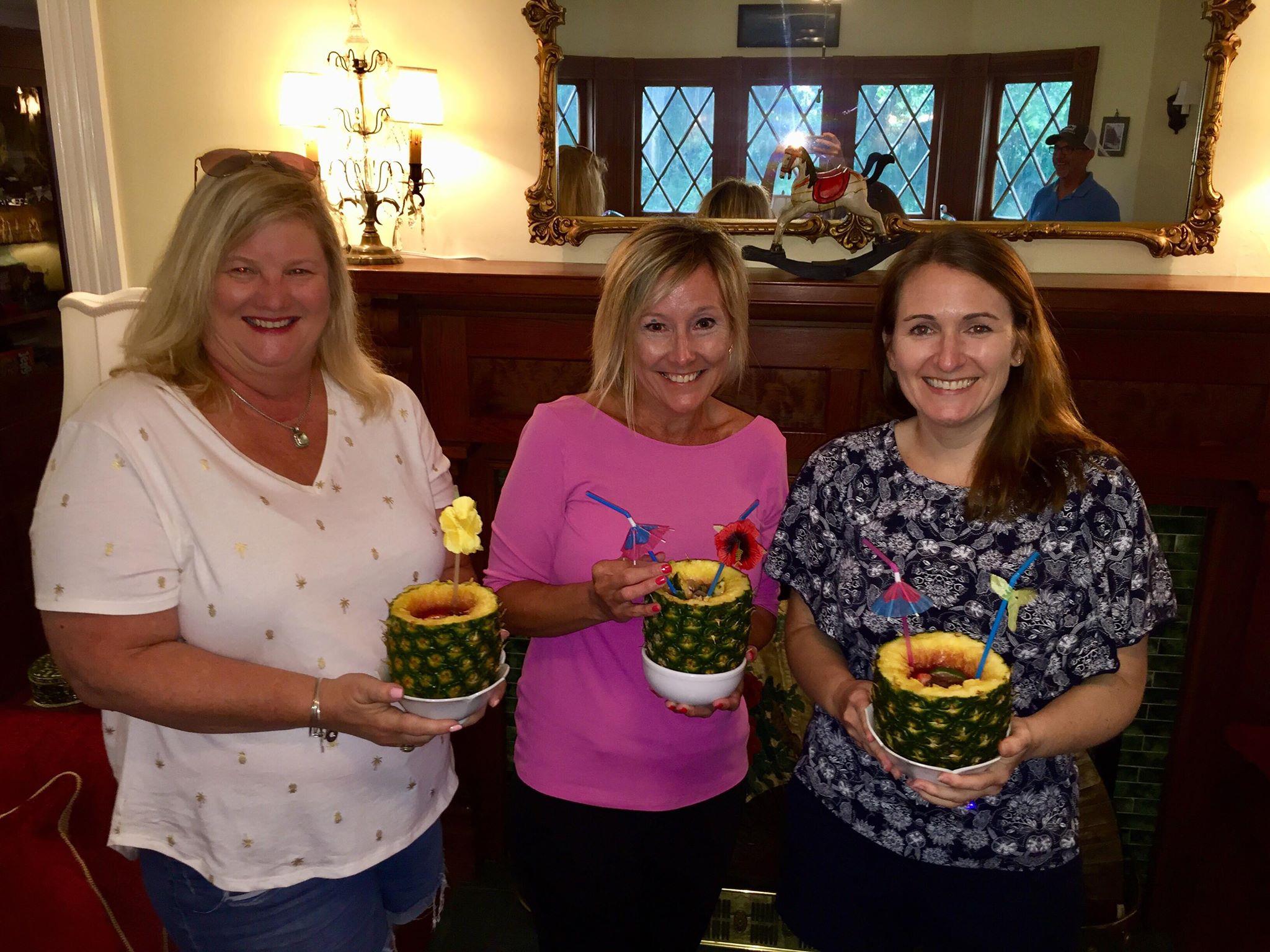 women-with-pineapple-drinks.jpg